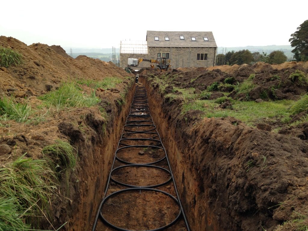 Ground source heat pump slinky trench