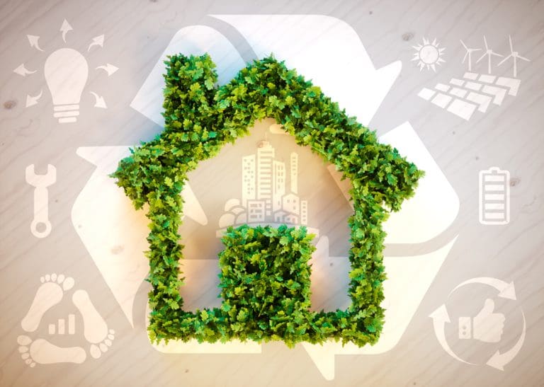 A green house icon, showing a house shape made out of bushes.