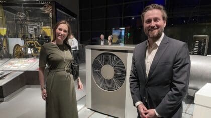 Olivia and Paul with an air source heat pump.