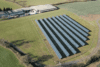Image of solar panels on a building from above.