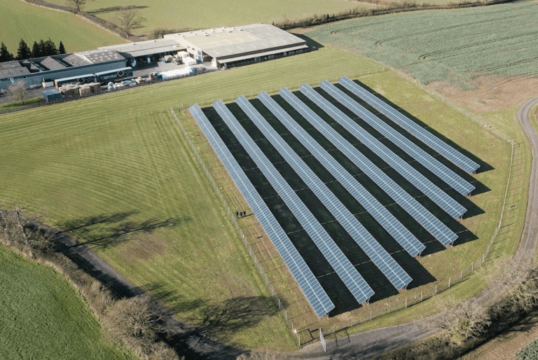 Image of solar panels on a building from above.