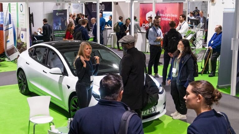 Climate Technology Show attendees looking at Electric car