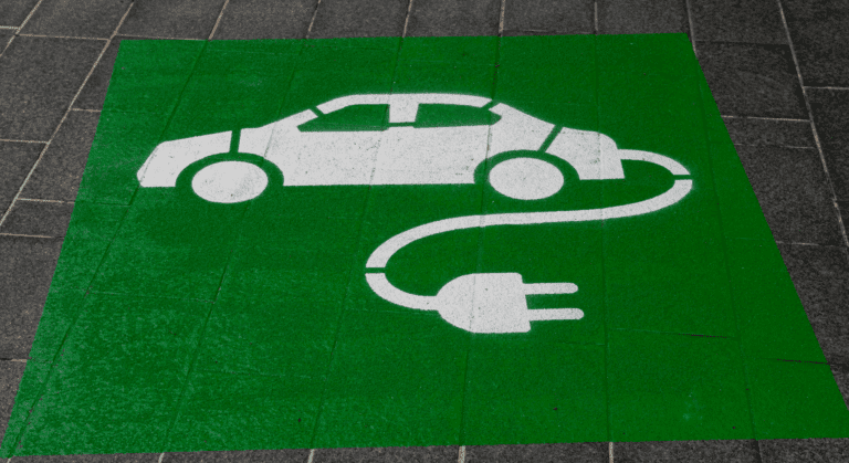 Electric vehicle symbol on a green background