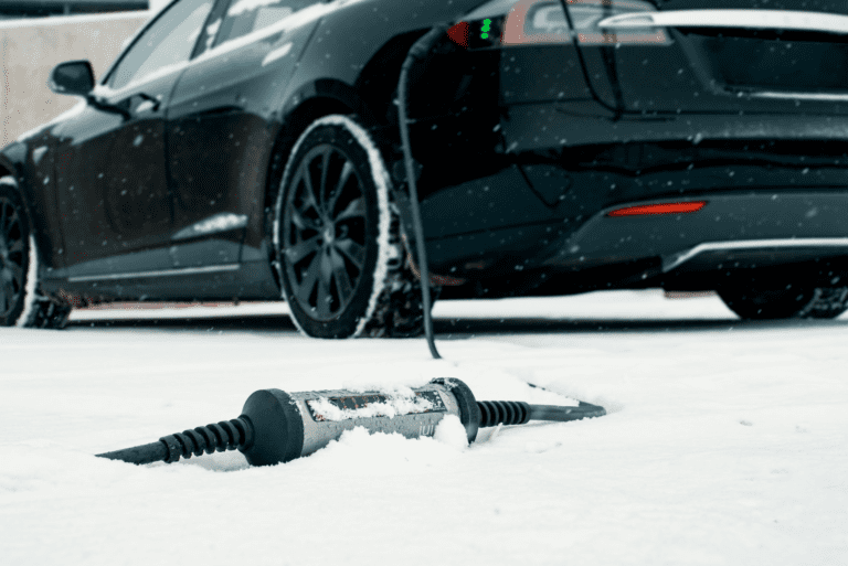 Black EV car in the snow
