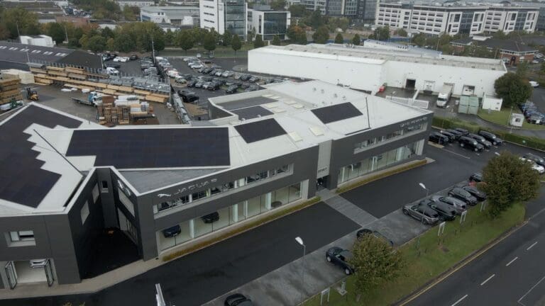 An aerial view of the JLR showroom with solar panels on the roof.